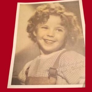 This 8x10 photograph features the beloved child actress Shirley Temple